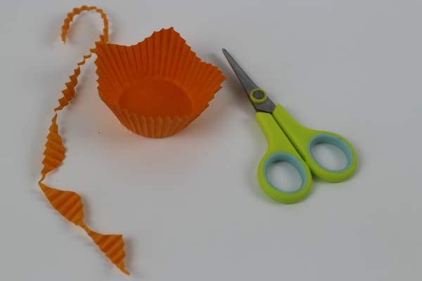 An Orange cake case cut to resemble a daffodil flower petal