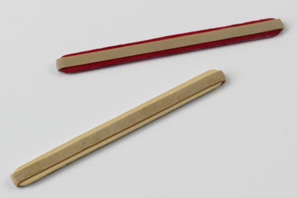 Elastic bands on popsicle sticks