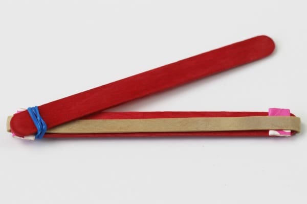 Elastic bands on popsicle sticks 4