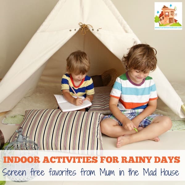 Child playing at home indoors with a teepee tent