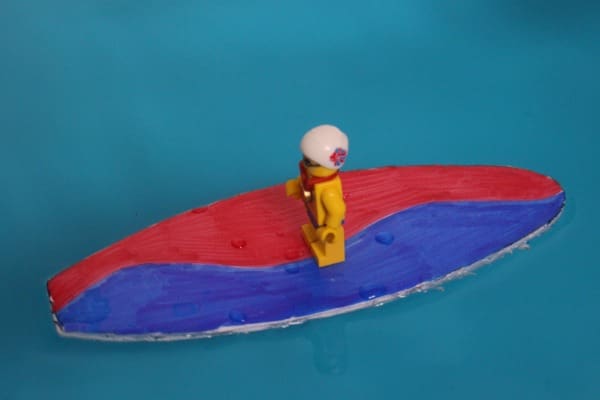 Minifigure on surfboard