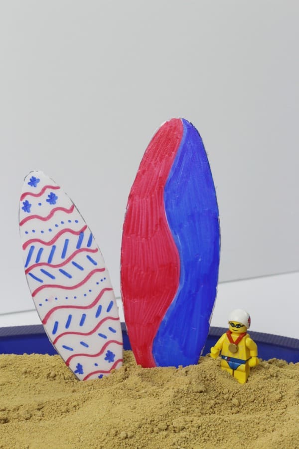 A fun summer surfboard craft for kids that lets their favorite small toys surf! Also a great craft for a pool party or surfing-themed birthday party.