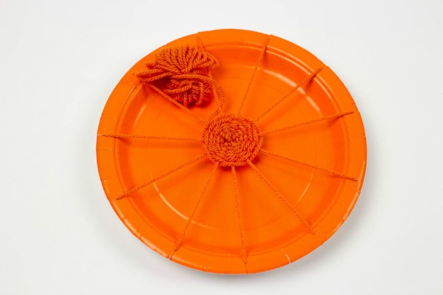 Pumpkin paper plate weaving