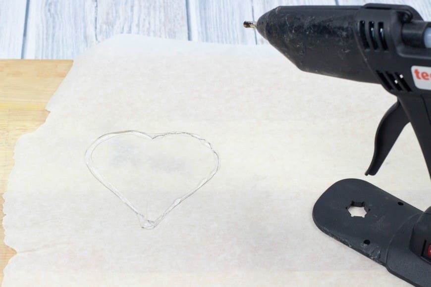 Hot Glue Gun Confetti Heart Cake Topper. This is a fab DIY craft to make a confetti heart, which is perfect as a cake topper for celebrations and if you only confetti one side they make a brilliant window cling. You could make any shape, letter, or number. You could even frame it as art instead of putting a toothpick in it as a cake topper