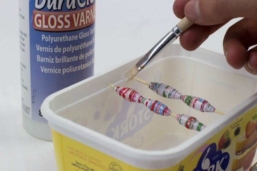 How to make paper beads from wrapping paper. What a fab craft DIY for recycling paper into jewelry. These would make the perfect DIY gift for Mother's Day. I never realised it was THIS simple!