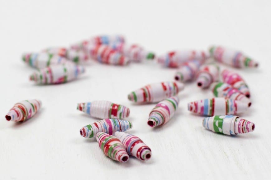 How to make paper beads from wrapping paper. What a fab craft DIY for recycling paper into jewelry. These would make the perfect DIY gift for Mother's Day. I never realised it was THIS simple!
