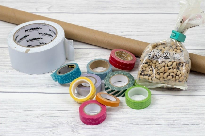 DIY Rainmaker or rainstick craft for kids. This is a super simple craft and musical instrument activity for children. Traditionally made from dried cacti, this simple DIY rainstick has the same sound and is also a perfect rainbow craft too