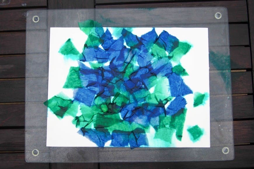 Bleeding Tissue Paper Rain Art for Earth Day. This fab process art is great for getting kids crafting outside. Beautiful art made by kids using the bleeding tissue paper technique.