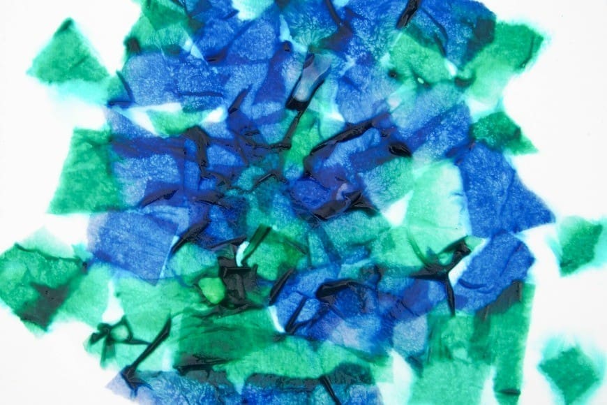 Bleeding Tissue Paper Rain Art for Earth Day. This fab process art is great for getting kids crafting outside. Beautiful art made by kids using the bleeding tissue paper technique.