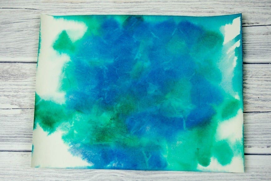 Bleeding Tissue Paper Rain Art for Earth Day. This fab process art is great for getting kids crafting outside. Beautiful art made by kids using the bleeding tissue paper technique.