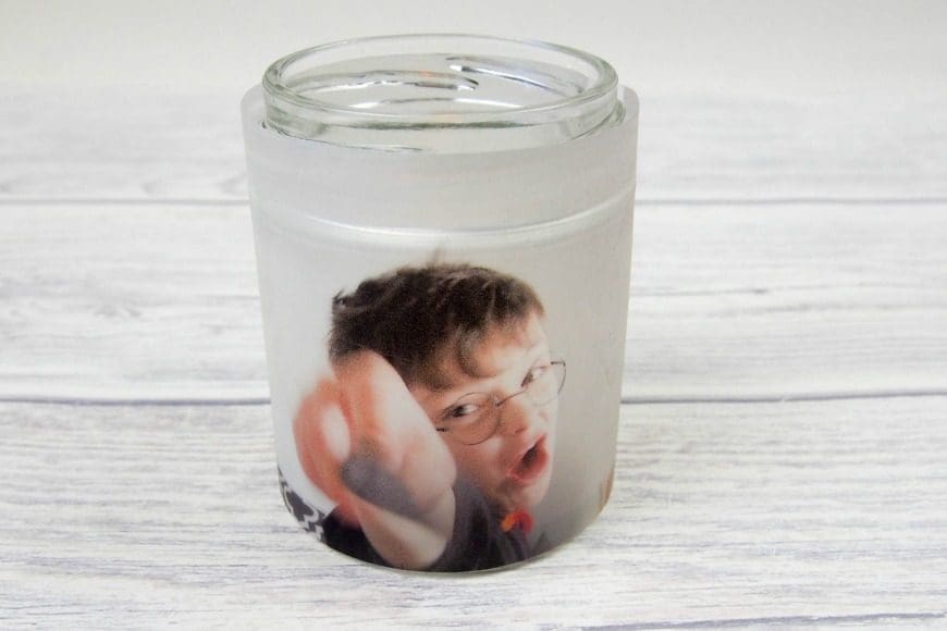 Upcycle glass jars into a stunning glowing photo jar luminaries. This beautiful photo luminaries glow when you add a candle and make the perfect gifts. What a fun DIY craft.