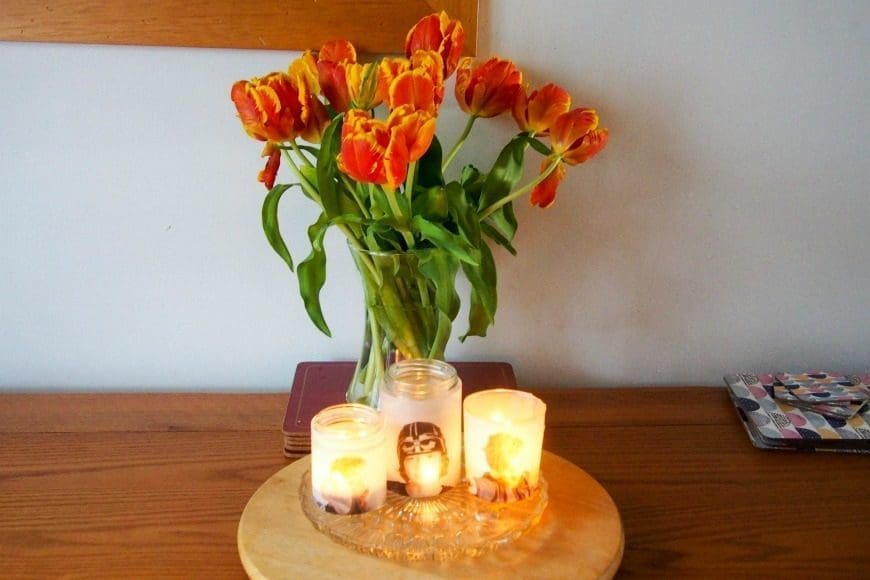 Upcycle glass jars into a stunning glowing photo jar luminaries. This beautiful photo luminaries glow when you add a candle and make the perfect gifts. What a fun DIY craft.