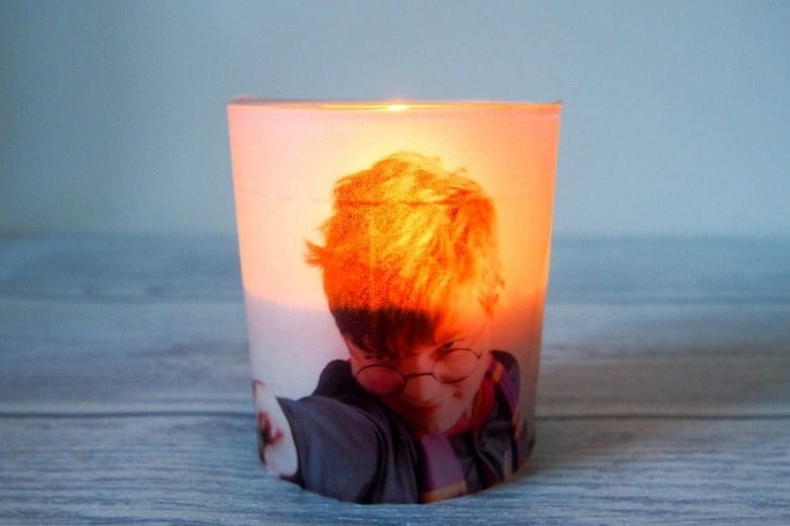 Upcycle glass jars into a stunning glowing photo jar luminaries. This beautiful photo luminaries glow when you add a candle and make the perfect gifts. What a fun DIY craft.