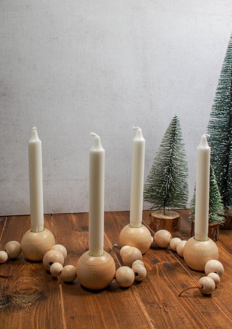 This beautiful DIY Advent Candle is Inspired by the Ferm Living Wooden Bead one. Find out how simple it is to make your own wooden bead advent candle.