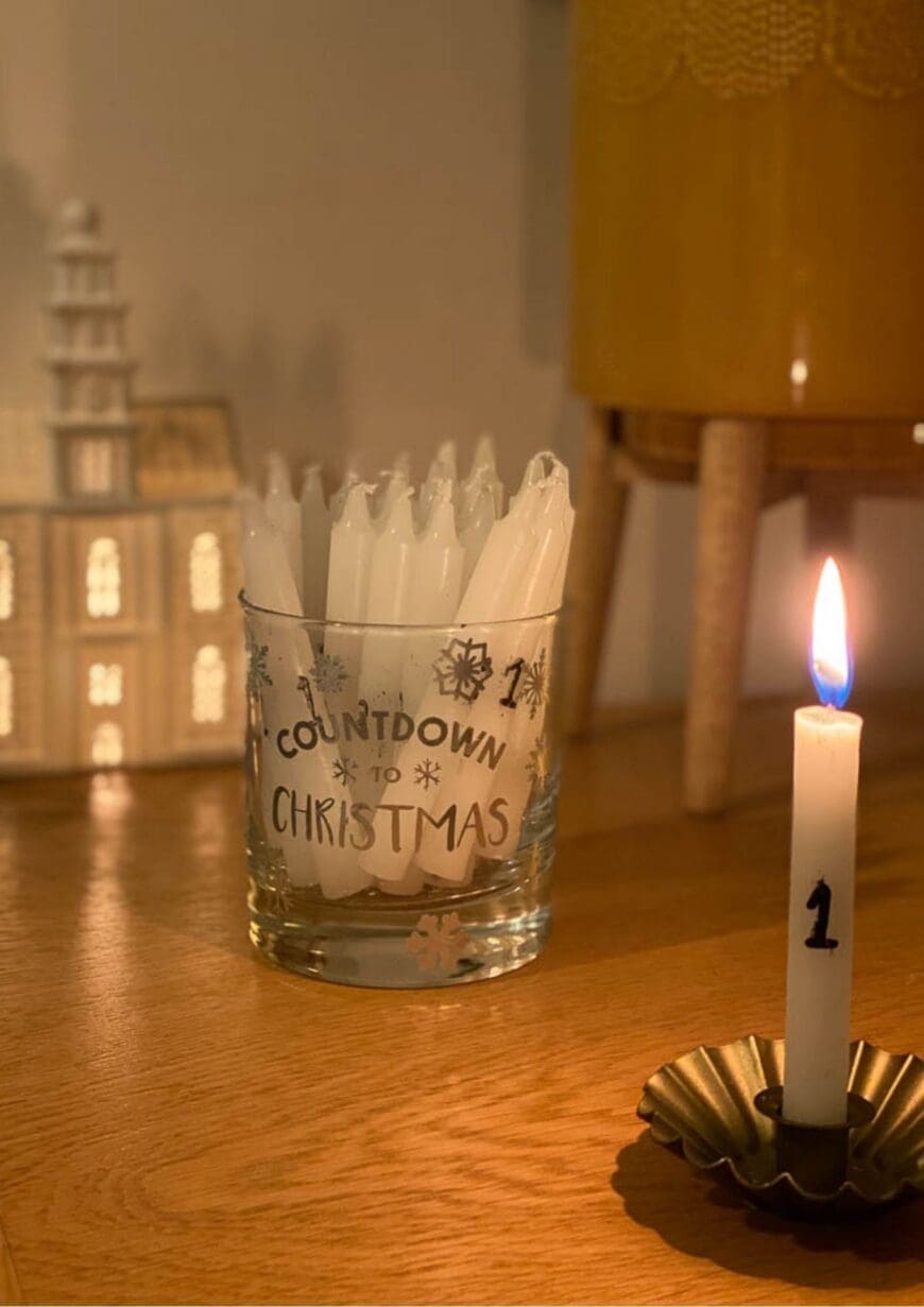 Tutorial to make 24 DIY Numbered Advent Candles perfect for the build-up to Christmas. These advent candles are perfect for December.  