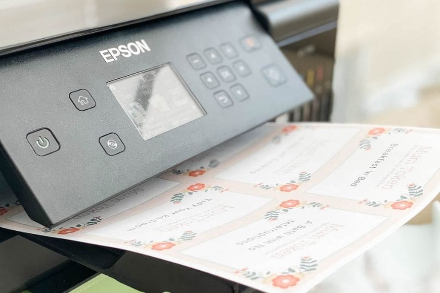 Free Printable Mother's Day Coupon Book coming out of the printer