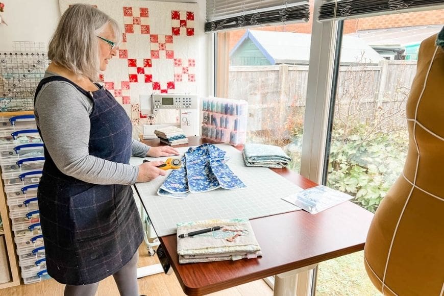 Cutting fabric at an adjustable desk