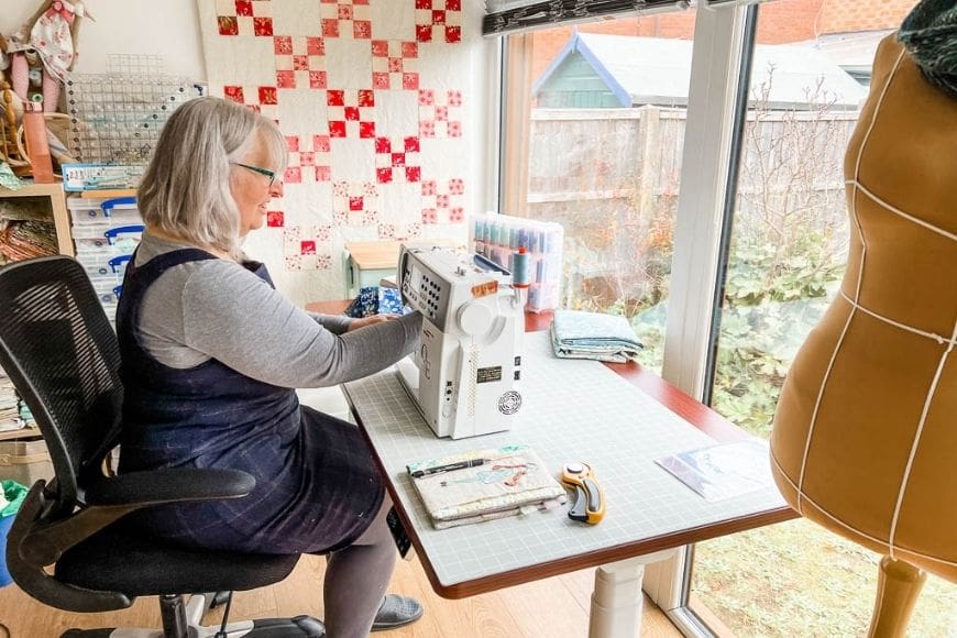 Sitting sewing at an adjustable desk