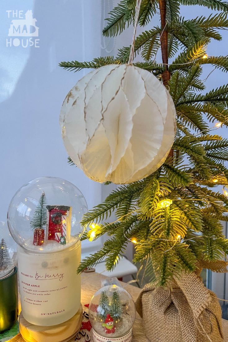 Make beautiful honeycomb Christmas ornaments using cake cases! This simple and budget-friendly DIY craft will add a festive and personalized touch to your holiday decorations.