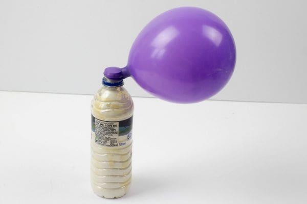 filling the balloon with flour