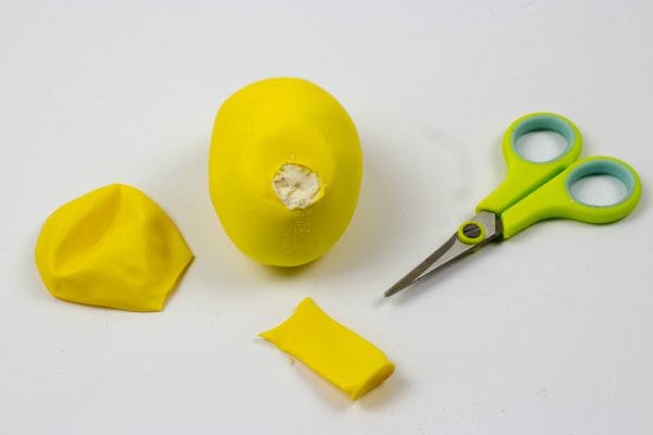 cutting the neck off tha balloon