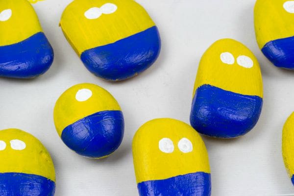 Stone Minions. Join in with the Minion Madness by making these Minions from stones or rocks with your children. This is a super simple kids craft activity.