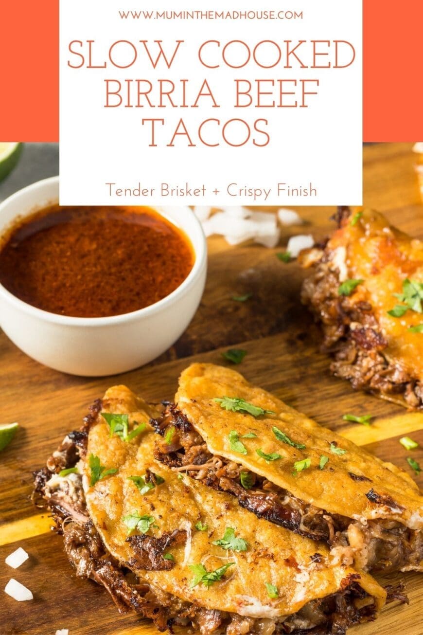 Crispy slow-cooked birria beef tacos filled with tender brisket, garnished with fresh herbs, beside a bowl of spiced consomé on a rustic wooden board.